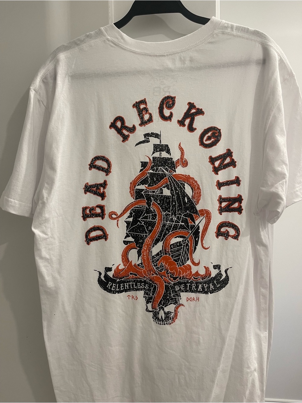Dead Reckoning Ship and Sea Creature Graphic Tee
